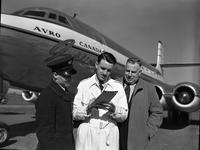 New York Flight: Don Rogers signing air mail clearance forms.