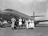 New York Flight; Costume girls in front of jetliner